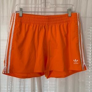 Adidas women’s 3 stripe shorts orange
